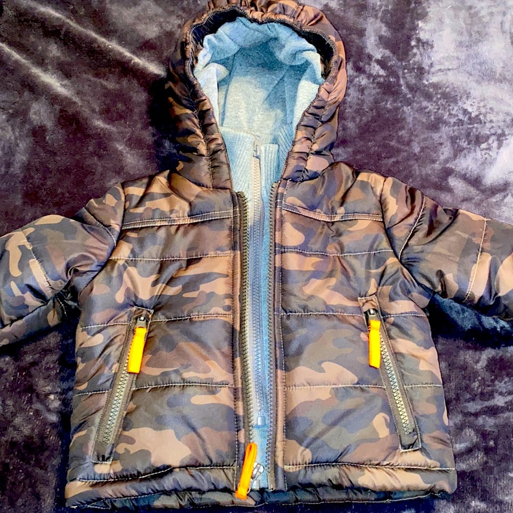 Camouflage puffer coat.